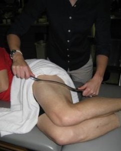 Dr. Brown Budde performing Graston Technique